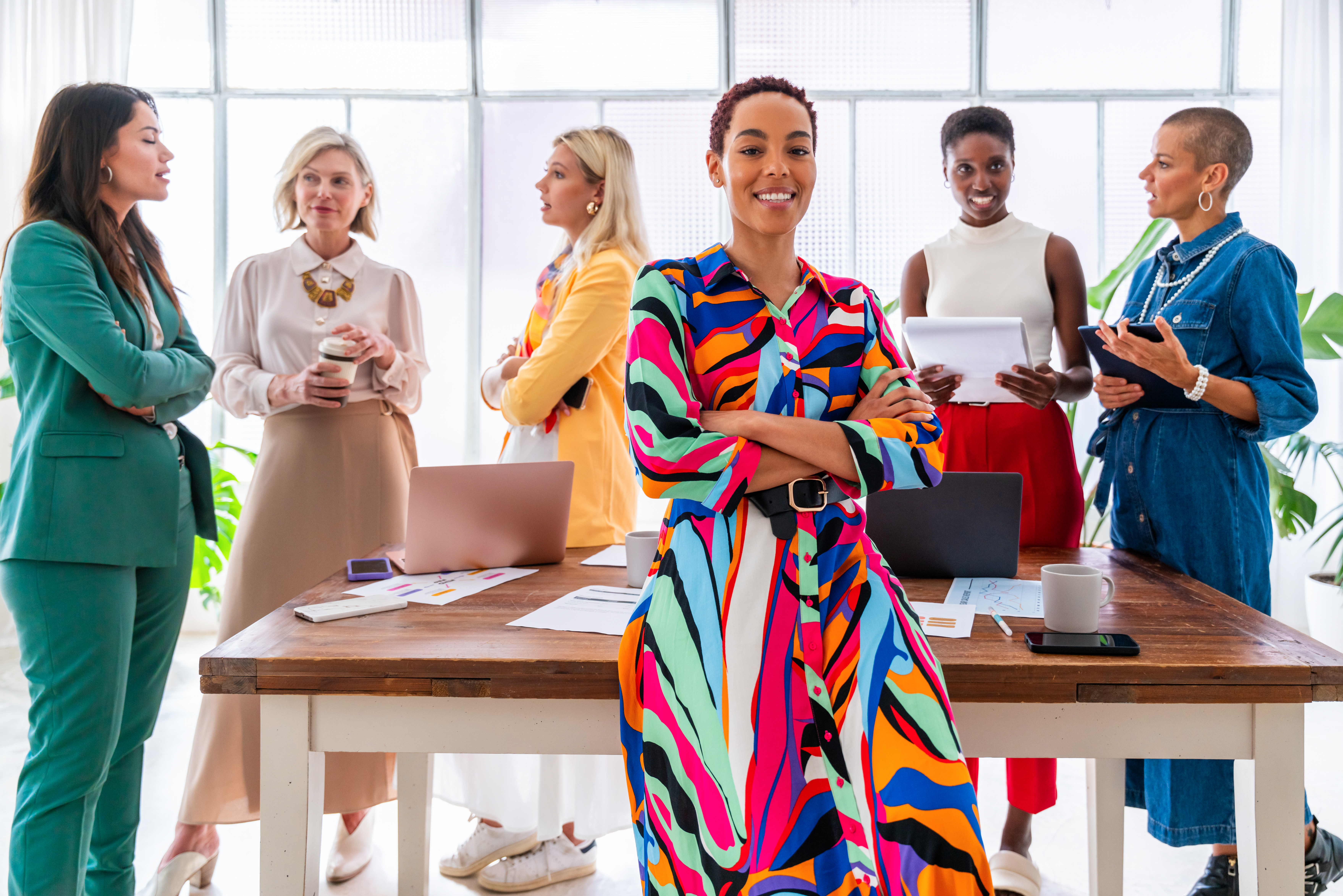 Group of businesswomen meeting in the office Group of beautiful confident businesswomen meeting in the office - Multiethinc female creative team brainstorming at work - Diverse colleagues working together in workshop in a co-working space